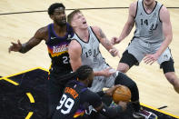 Phoenix Suns forward Jae Crowder (99) strips the ball from San Antonio Spurs forward Luka Samanic (19) as center Deandre Ayton (22) defends during the first half of an NBA basketball game Saturday, April 17, 2021, in Phoenix. (AP Photo/Rick Scuteri)