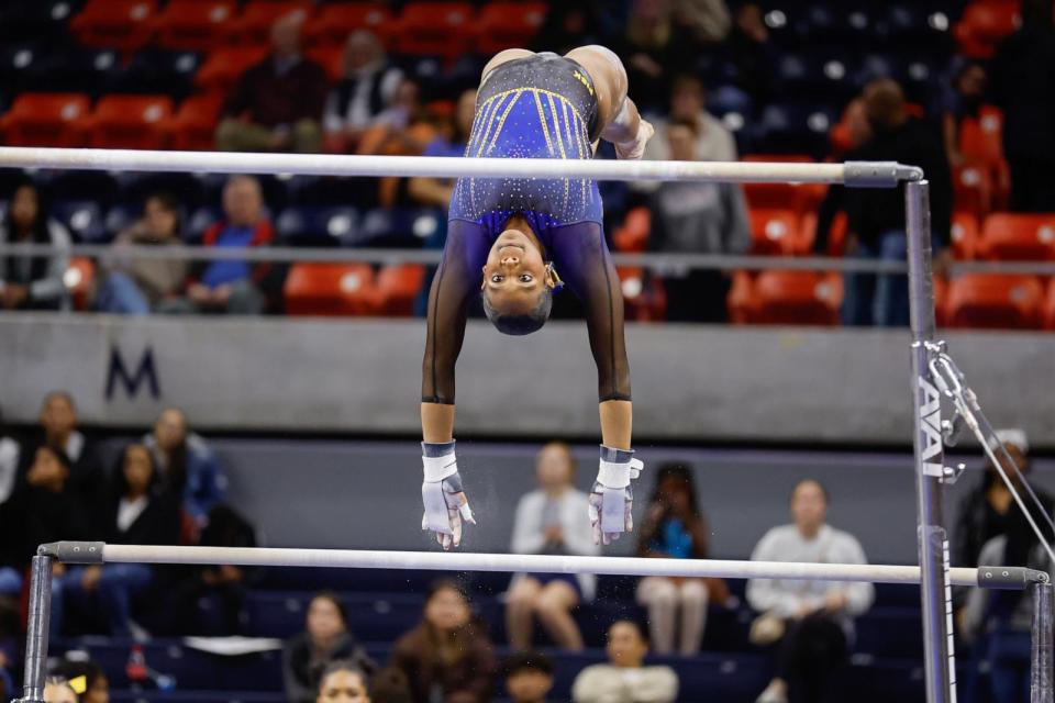 PHOTO: Morgan Price, of the Fisk Bulldogs, competes on the uneven bars at Neville Arena on February 2, 2024 in Auburn, Alabama. (Stew Milne/Getty Images)