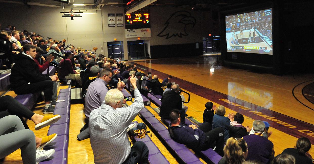 Fans cheer as Ashland scores during a watch party for the women’s basketball team Saturday. The Eagles claimed the national championship with a 78-67 win over Minnesota.