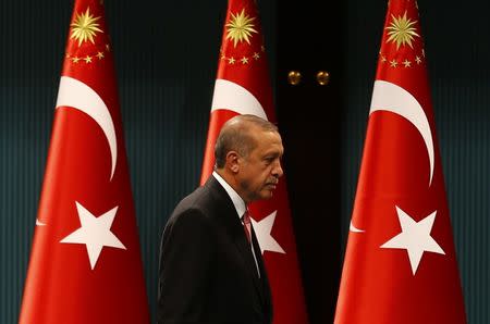 Turkish President Tayyip Erdogan leaves after a news conference following the National Security Council and cabinet meetings at the Presidential Palace in Ankara, Turkey, July 20, 2016. REUTERS/Umit Bektas