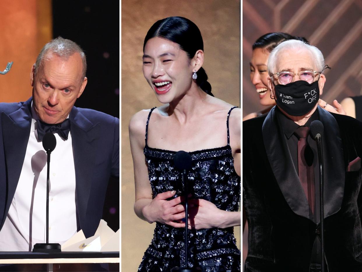 left to right: michael keaton, jung ho-yeon, and brian cox accepting their awards at the 2022 sag awards