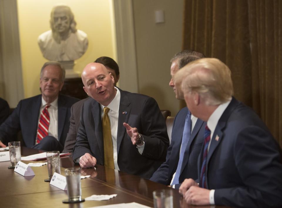 <div class="inline-image__caption"><p>Nebraska Gov. Pete Ricketts speaks to President Donald Trump during a meeting on trade on April 12, 2018, in Washington, D.C.</p></div> <div class="inline-image__credit">Getty</div>