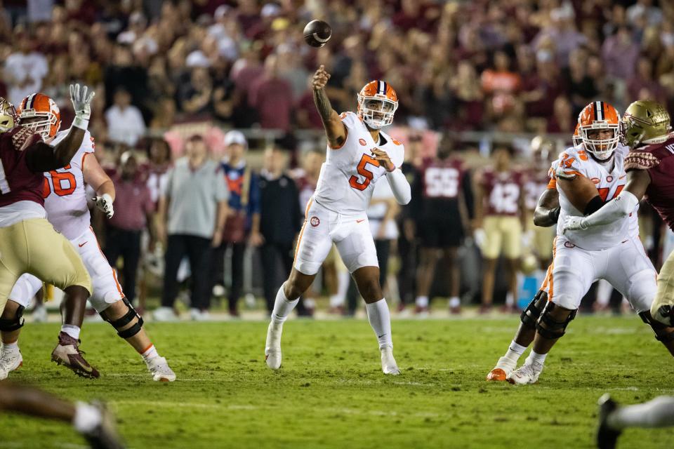 Clemson Tigers quarterback DJ Uiagalelei (5) passes the ball down the field to his teammate. The Clemson Tigers defeated the Florida State Seminoles 34-28 at Doak Campbell Stadium on Saturday, Oct. 15, 2022.