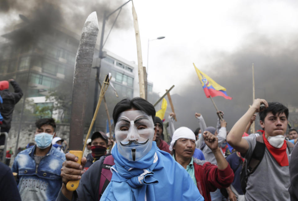 Anti-government protesters clash with police near the National Assembly in Quito, Ecuador, Tuesday, Oct. 8, 2019. Anti-government protests, which began when President Lenín Moreno’s decision to cut subsidies led to a sharp increase in fuel prices, has persisted for days, and clashes led the president to move his besieged administration out of Quito. (AP Photo/Dolores Ochoa)