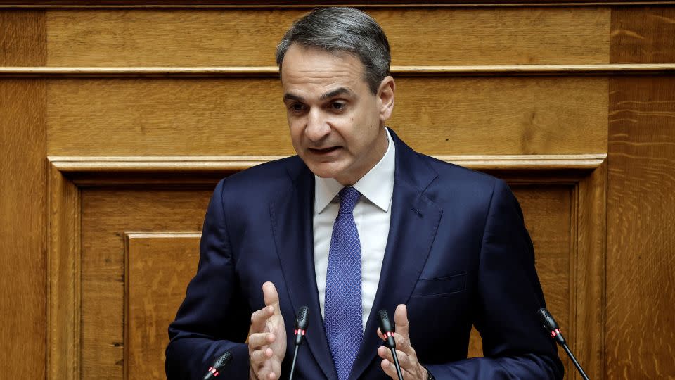 Greek Prime Minister Kyriakos Mitsotakis speaks at parliament on February 15. - Louisa Gouliamaki/Reuters