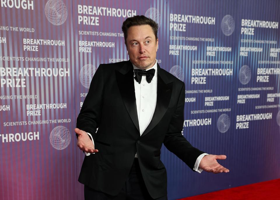 Elon Musk on a red carpet.