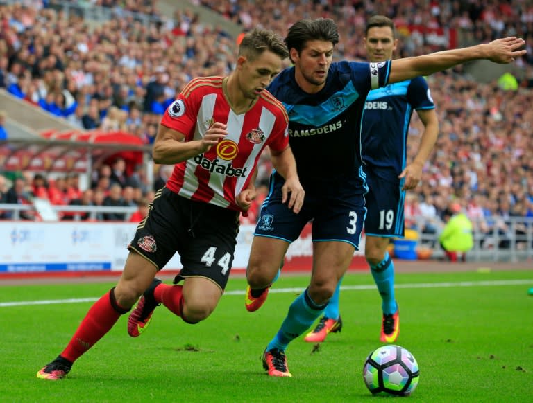 Kosovo will make history playing their first ever competitive match in a World Cup qualifier, but still have a number of players awaiting FIFA clearance including Belgian midfielder Adnan Januzaj (L)