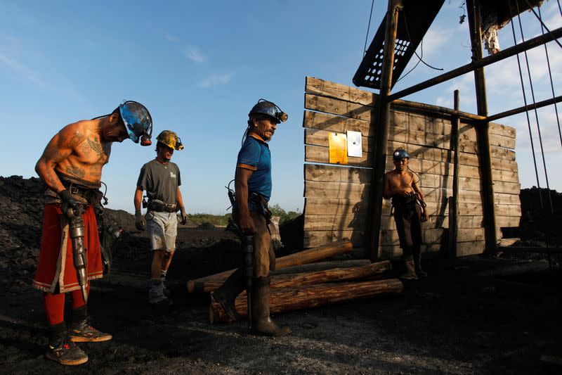 The Wider Image: Deep underground, Mexican coal miners remember those who never came back