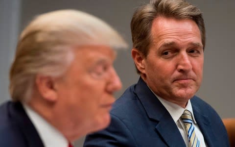 Donald Trump with Jeff Flake - Credit: AFP