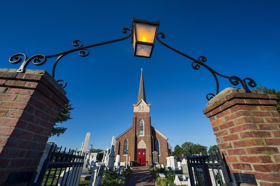 Historic St. Peter’s Episcopal Church (Lewes, Delaware)
Dating back to 1708, the churchyard (resting places for many notables in Lewes) in front of Historic St. Peter’s Episcopal Church is framed by a wrought-iron archway and then, beyond, is the brick chapel (built a century later). The original communion table is still in use for Sunday service.