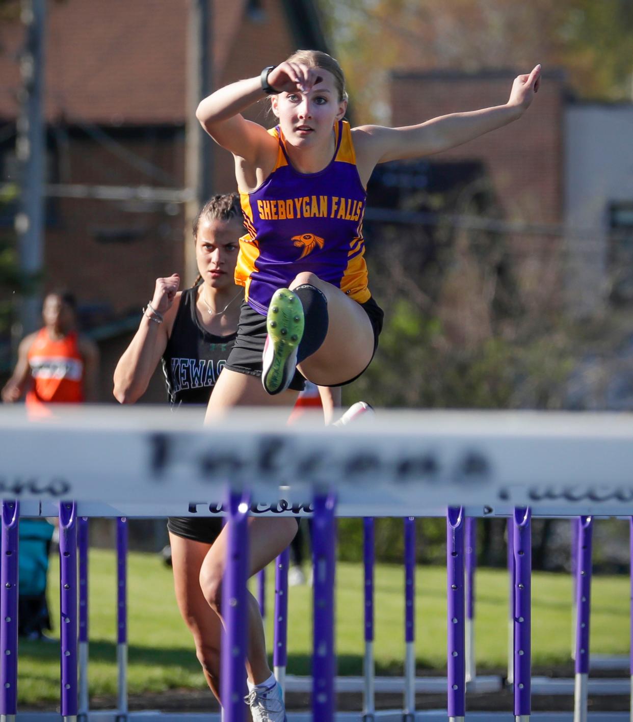 Sheboygan Falls’ Rachel Halverson leaps up a hurdle during the 53rd Annual Vanderpan Track Invitational, Friday, May 3, 2024, in Sheboygan Falls.