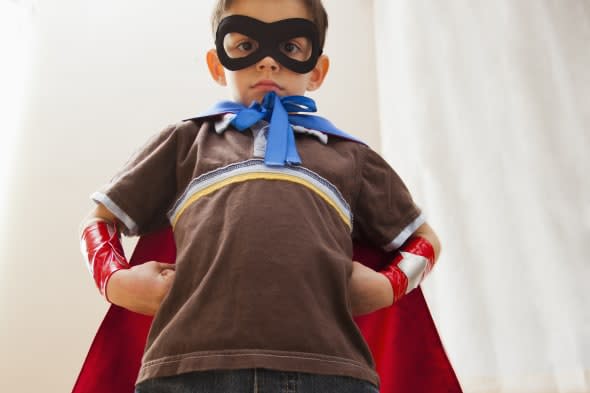 Low angle view of boy (6-7) in fancy dress costume