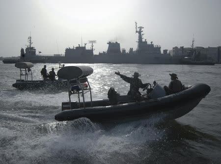 Pakistan Navy personnel keep guard near the Navy ship PNS Zulfiqar after it returned to Karachi June 23, 2011. REUTERS/Stringer