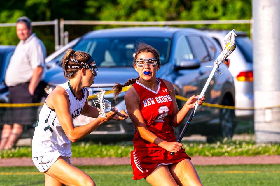 New Bedford's Tatum Reis looks to change directions on Dartmouth's Katherine Cheesebro.