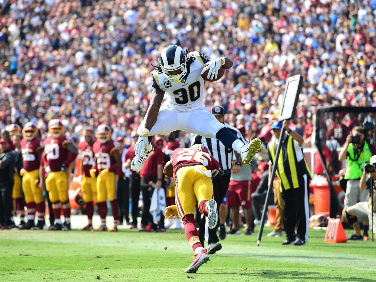 Todd Gurley hurdles a Redskins defender - and the Rams are Ed's Super Bowl pick: Getty 2017
