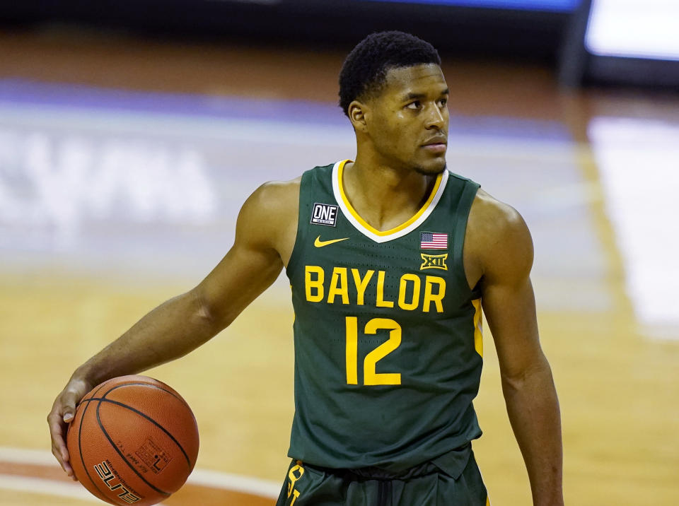 FILE - In this Feb. 2, 2021, file photo, Baylor guard Jared Butler controls the ball during an NCAA college basketball game against Texas in Austin, Texas. Butler and still-undefeated No. 2 Baylor are ready to get back to playing games after a three-week break because of COVID-19 issues in the program. (AP Photo/Eric Gay, File)