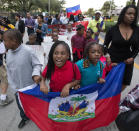 <p>Haitian-Americans march to commemorate the eighth anniversary of the Haitian earthquake, Friday, Jan. 12, 2018, in Miami, Fla. (Photo: Wilfredo Lee/AP) </p>