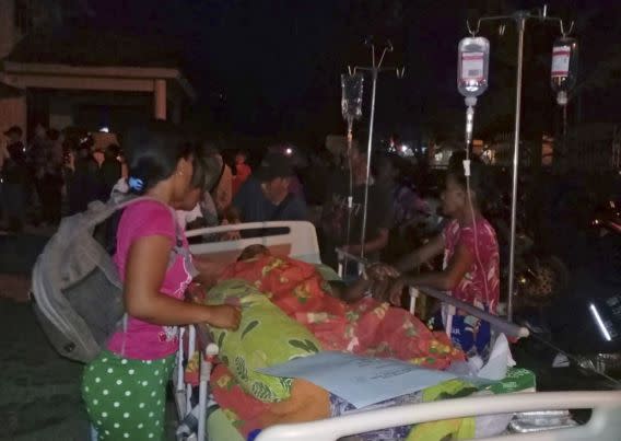 Patients are evacuated from a hospital following the earthquake (AP Photo/Yohanes Litha)