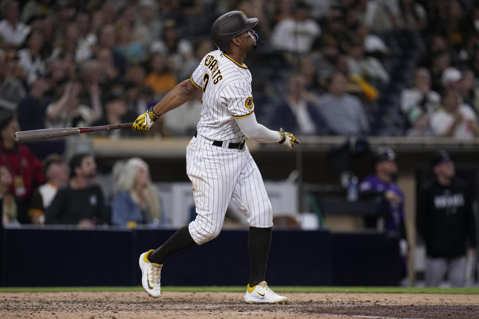 San Diego Padres' Xander Bogaerts watches his walk off two-run home run during the ninth inning of a baseball game against the Colorado Rockies, Tuesday, Sept. 19, 2023, in San Diego. (AP Photo/Gregory Bull)