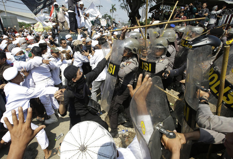 Muslim hard-liners clash with police