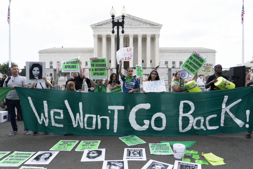 Abortion right activists gather outside the Supreme Court in Washington, Friday, June 24, 2022. The Supreme Court has ended constitutional protections for abortion that had been in place nearly 50 years, a decision by its conservative majority to overturn the court's landmark abortion cases. (AP Photo/Jose Luis Magana)