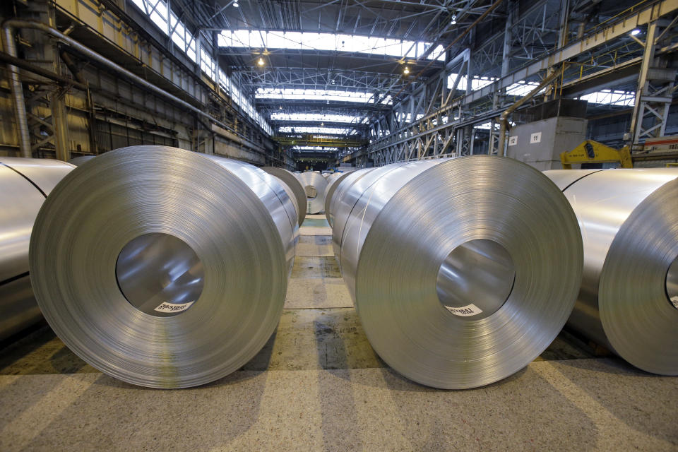 FILE- In this Feb. 15, 2013, file photo, finished galvanized steel coils await shipment at ArcelorMittal Steel's hot dip galvanizing line in Cuyahoga Heights, Ohio. President Donald Trump’s tariffs are expected to raise prices for steel and aluminum in this country. That will help domestic producers and could create several hundred new steelworker jobs. (AP Photo/Mark Duncan, File)