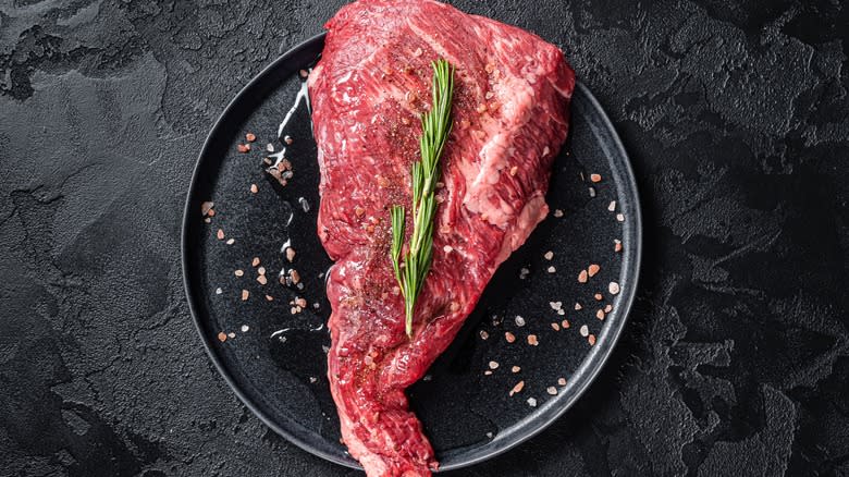 raw tri tip steak on plate