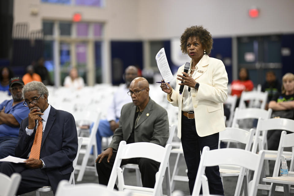 Joann Johnson, of St. Augustine, Fla., asks a question of panelists during the Voters Education 2024 Community Forum, addressing the Florida Legislature's voter suppression tactics, Thursday, May 16, 2024, in Daytona Beach, Fla. Laws passed in several Republican-controlled states are making it challenging for advocates to adapt as they try to register and educate potential voters with just months to go before the presidential election. (AP Photo/Phelan M. Ebenhack)