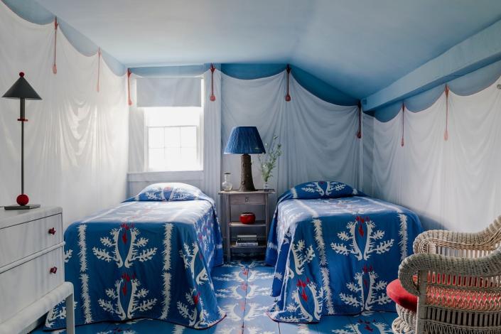 The guest room’s faux-draped walls and ceiling were painted by decorative artist Agustin Hurtado.&nbsp;Chris Pearson, a fellow artist, painted the floor to mimic the bed coverlets of Pierre Frey’s Sirenes.