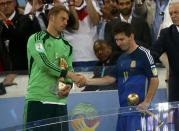 Golden Glove winner Germany's goalkeeper Manuel Neuer (L) congratulates Golden Ball winner Argentina's Lionel Messi (10) after their 2014 World Cup final at the Maracana stadium in Rio de Janeiro July 13, 2014. REUTERS/Kai Pfaffenbach (BRAZIL - Tags: SOCCER SPORT WORLD CUP)