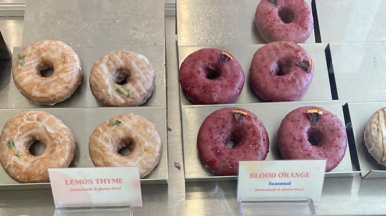 gluten free donuts on display in glass case