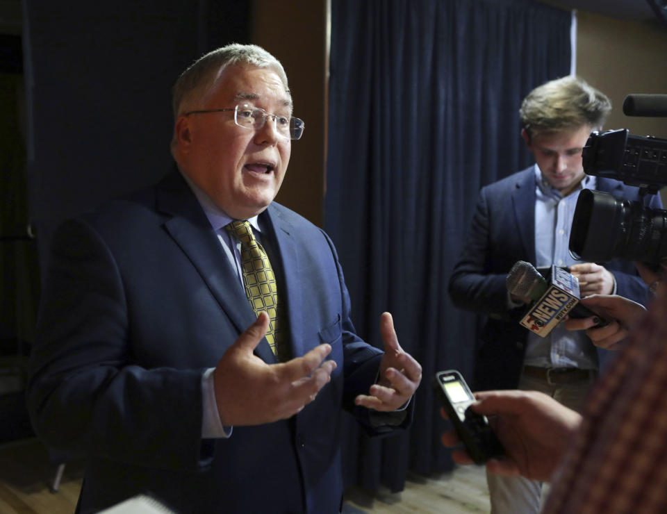 FILE - In this Nov. 1, 2018, file photo, Patrick Morrisey speaks to reporters after a debate in Morgantown, W.Va. Morrisey has sued the Wheeling-Charleston Roman Catholic Diocese and former Bishop Michael Bransfield, accusing them of knowingly employing pedophiles and failing to conduct adequate background checks on camp and school workers. (AP Photo/Raymond Thompson, File)