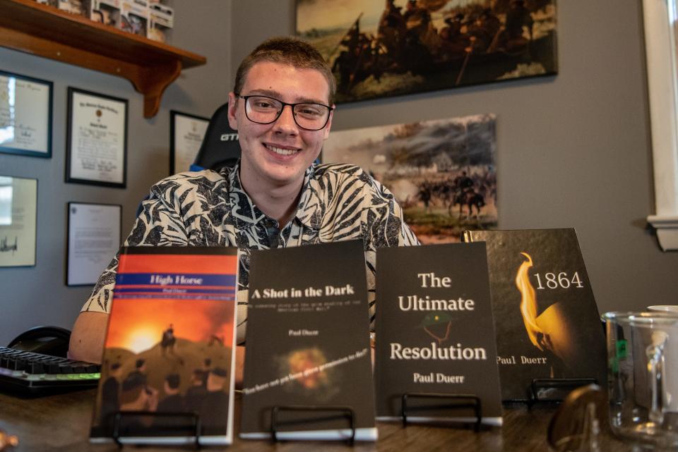 Paul Duerr, an incoming senior at Hawthorne High School, wrote four books during the COVID-19 pandemic. Here, he poses for a photo at his home on Mawhinney Avenue on June 14.