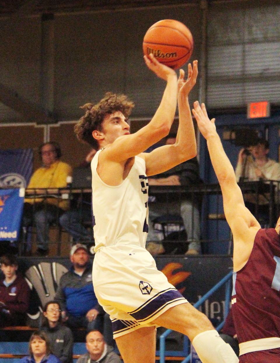 El Paso-Gridley senior Asa Smith takes a shot against St. Joseph-Ogden Wednesday. Smith had 13 points — all in the second half — in the Titans' 45-32 win at the Clifton Sectional.