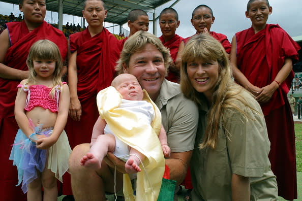 SUNSHINE COAST, AUSTRALIA – JANUARY 2: (EUROPE AND AUSTRALASIA OUT) Steve Irwin and wife Terri, with daughter Bindi and baby son Bob, at a blessing ceremony by Tibetan Buddhist nuns, for the Irwin youngster. (Photo by Graeme Parkes/Newspix/Getty Images)