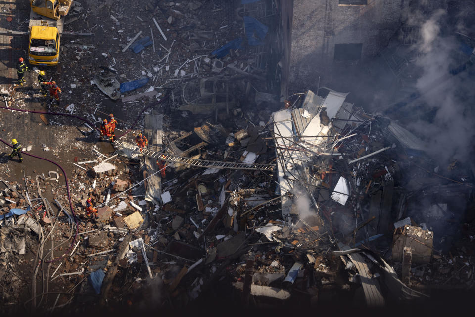 Firefighters work the scene of an explosion in Sanhe city in northern China's Hebei province on Wednesday, March 13, 2024. Rescuers were responding to a suspected gas leak explosion Wednesday in a building in northern China, authorities said. (AP Photo/Ng Han Guan)