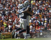 Dallas Cowboys wide receiver Devin Smith (15) celebrates his touchdown with teammate wide receiver Michael Gallup (13) in the first half of an NFL football game against the Washington Redskins, Sunday, Sept. 15, 2019, in Landover, Md. (AP Photo/Alex Brandon)