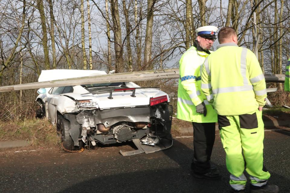 Wreckage: The white Lamborghini at the side of the road (Eamonn and James Clarke)