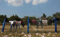 <p>Clothing hangs to dry at a sports center being used as a base for a few days by a caravan of Central American migrants who are part of the annual Migrant Stations of the Cross caravan or “Via crucis,” organized by the “Pueblo Sin Fronteras” activist group, in Matias Romero, Oaxaca state, Mexico, Monday, April 2, 2018. (Photo: Felix Marquez/AP) </p>