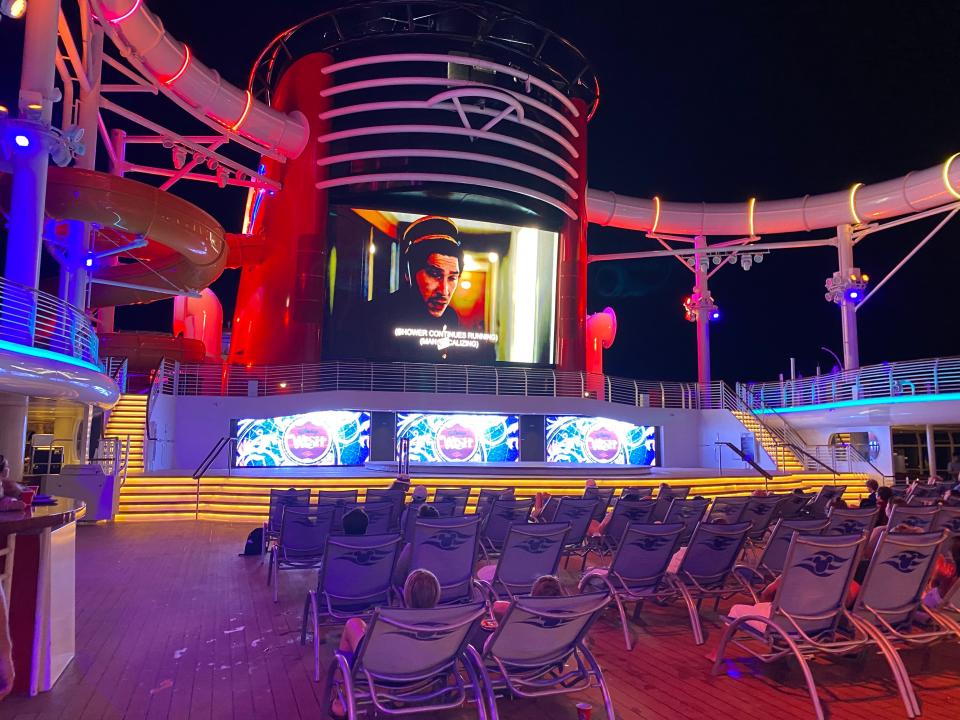 A movie screen onboard the Disney Wish cruise ship.