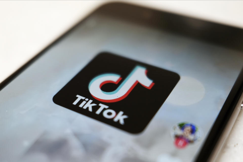 FILE - This Monday, Sept. 28, 2020, file photo, shows as  logo of a smartphone app TikTok on a user post on a smartphone screen in Tokyo. Canadian e-commerce platform Shopify said Tuesday, Oct. 27, 2020, it’s made a deal with TikTok enabling merchants to create “shoppable” video ads that drive customers to online stores. (AP Photo/Kiichiro Sato, File)