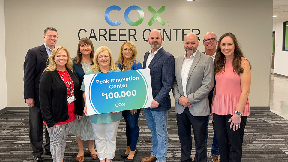 Cox donors stand with career development facilitators Stephanie Freeman and Amye Drackett at the Peak Innovation Center.