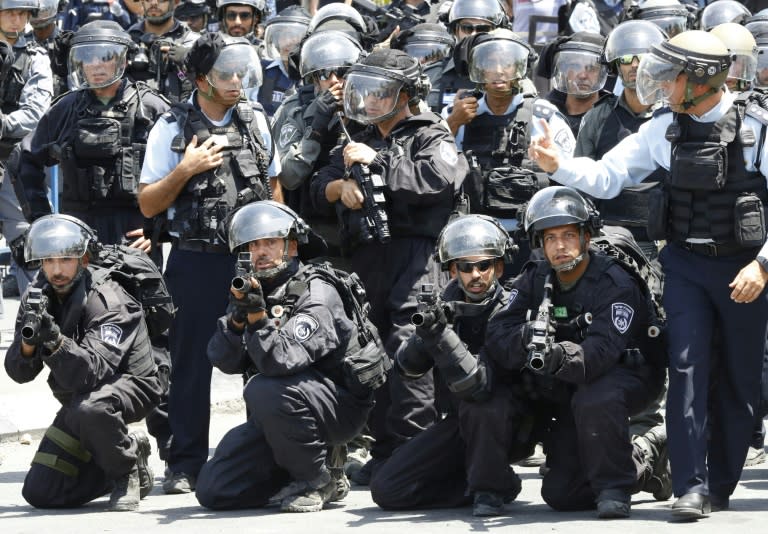 Israeli police hold stun grenades launchers following Friday noon prayers outside Jerusalem's Old City on July 28, 2017