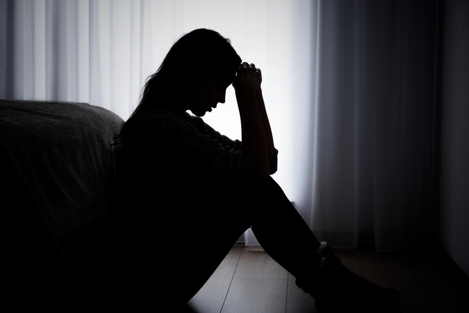 Woman suffering from depression, sadness and headache. (Photo via Getty Images)