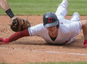 Cleveland Indians' Myles Straw slides safely back to first base ahead of a tag by Chicago White Sox's Gavin Sheets during the third inning of a baseball game in Cleveland, Sunday, Sept. 26, 2021. (AP Photo/Phil Long)
