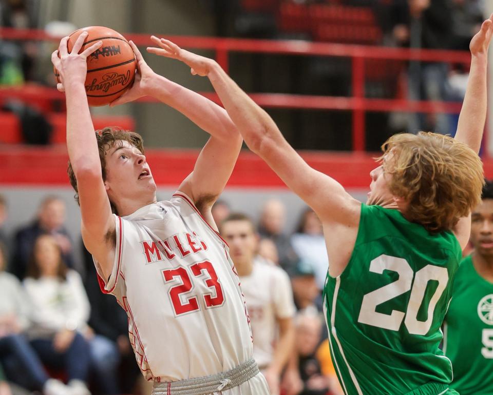 Max Hite of Bedford rises up to shoot over St. Mary Catholic Central’s Trent Zachel during a 58-52 Bedford win Friday night.