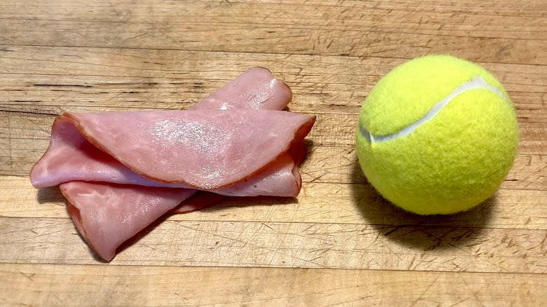 Deli ham and tennis ball