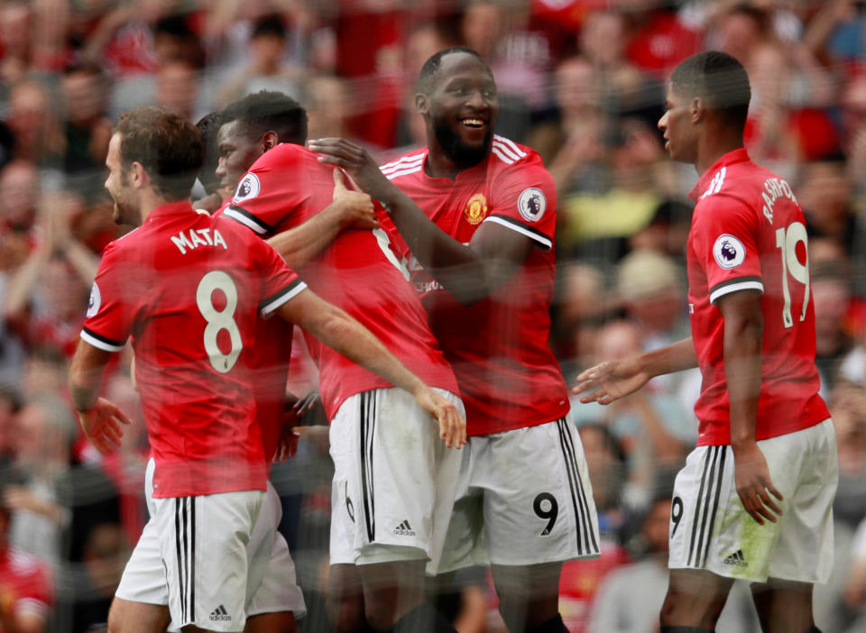 Romelu Lukaku celebrates with teammates after scoring the second goal