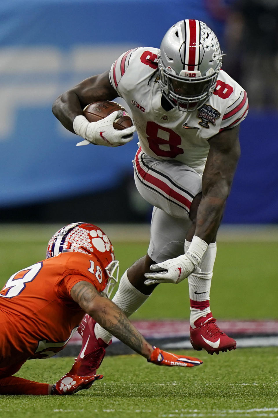 Ohio State running back Trey Sermon runs past Clemson safety Joseph Charleston during the first half of the Sugar Bowl NCAA college football game Friday, Jan. 1, 2021, in New Orleans. (AP Photo/Gerald Herbert)