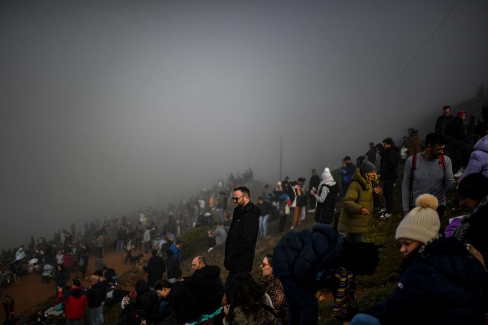 people gather and wait for better weather conditions for the start of the tudor nazare surfing challenge at praia do norte in nazare on december 12, 2021 photo by patricia de melo moreira afp photo by patricia de melo moreiraafp via getty images